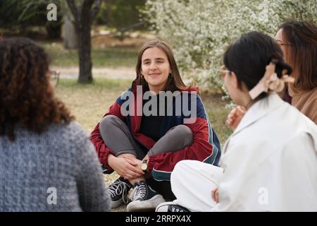 230415 -- BEIJING, April 15, 2023 -- Maria 2nd L chats with schoolmates at Peking University in Beijing, capital of China, March 31, 2023. Maria Eduarda Variani, Rafaela Viana dos Santos, Manuela Boiteux Pestana, and Marco Andre Rocha Germano are Brazilian students studying in the Master of China Studies program at the Yenching Academy of Peking University in China. The four of them have been interested in Chinese culture since they were young. After arriving in Beijing, they have been impressed by the Chinese capital s profound cultural heritage, convenient public services, and fabulous citys Stock Photo