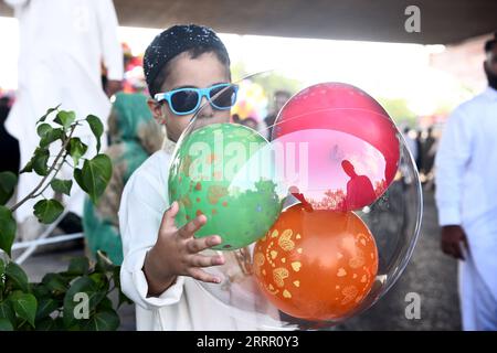 230422 -- KARACHI, April 22, 2023 -- A boy poses for a photo during Eid al-Fitr celebration in southern Pakistani port city of Karachi on April 22, 2023. Eid al-Fitr marks the end of the Islamic fasting month of Ramadan. /Xinhua PAKISTAN-KARACHI-EID AL-FITR-CELEBRATION Str PUBLICATIONxNOTxINxCHN Stock Photo