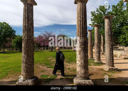 230424 -- ATHENS, April 24, 2023 -- A tourist visits the archaeological site of Olympia in Ancient Olympia on the Peloponnese peninsula in Greece, April 21, 2023.  GREECE-ANCIENT OLYMPIA-ARCHAEOLOGICAL SITE-TOURISM MariosxLolos PUBLICATIONxNOTxINxCHN Stock Photo