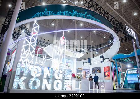 230425 -- WUHAN, April 25, 2023 -- People visit the Hong Kong pavilion during the 2nd China Wuhan Culture and Tourism Expo in Wuhan, central China s Hubei Province, April 22, 2023.  Xinhua Headlines: Music robots and motorhomes: China s tourism upgrades amid accelerated recovery WuxZhizun PUBLICATIONxNOTxINxCHN Stock Photo