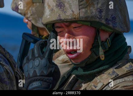 230429 -- KHUNJERAB, April 29, 2023 -- A soldier wipes sweat during a patrol in Khunjerab, northwest China s Xinjiang Uygur Autonomous Region, April 13, 2023. Gao Guanghui, a recruit who had just joined the army for 7 months, was shocked when he walked into the honor room of the border defense regiment in Khunjerab, northwestChina s Xinjiang Uygur Autonomous Region. The regiment is based on the Pamirs, guarding the China-Pakistan border and Khunjerab Port. With an average altitude of 4,700 meters, the place is a forbidden zone for many people, as the temperature here can drop to as low as minu Stock Photo