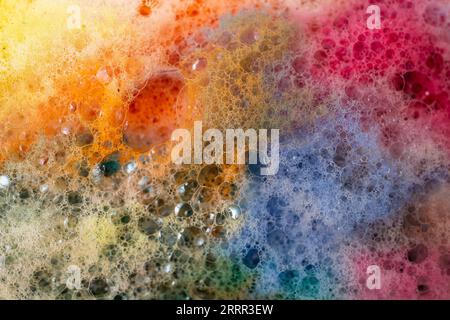 Multicolored foam rainbow bubbles, abstract soft focus close up texture Stock Photo