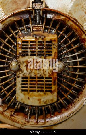 Dirty with burned grease cooker hood filter fan motor, soft focus close up Stock Photo