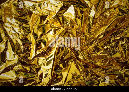 Metallic golden backdrop for christmas holiday card, soft focus close up Stock Photo