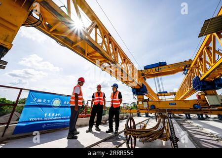 230505 -- KOTA BHARU, May 5, 2023 -- Zhang Tan C, leader of the first Youth Rapid Response Team of the East Coast Rail Link ECRL, a major infrastructure project under the Belt and Road Initiative BRI, inspects a construction site in Kelantan, Malaysia, April 26, 2023. TO GO WITH Feature: Chinese, Malaysian youths dedication shines on BRI East Coast Rail Link megaproject  MALAYSIA-KELANTAN-BRI-MEGAPROJECT-YOUTHS ZhuxWei PUBLICATIONxNOTxINxCHN Stock Photo