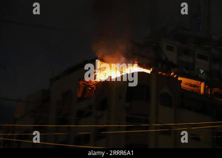 230509 -- GAZA, May 9, 2023 -- A fire breaks out at an apartment following an Israeli airstrike in Gaza City, May 9, 2023. Photo by /Xinhua MIDEAST-GAZA CITY-AIRSTRIKE RizekxAbdeljawad PUBLICATIONxNOTxINxCHN Stock Photo