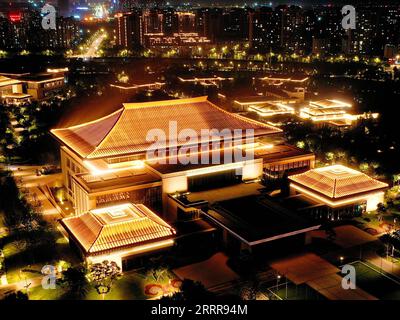 230516 -- XI AN, May 16, 2023 -- This aerial photo taken on May 1, 2023 shows a night view of the Xi an international convention center at the Chanba ecological zone in Xi an, northwest China s Shaanxi Province. As the provincial capital of northwest China s Shaanxi Province, Xi an, a city founded more than 3,100 years ago, served as the capital for 13 dynasties in Chinese history, including Tang 618-907, when the city was known as Chang an. This is also the place where Zhang Qian began his journey to the Western regions via Central Asia during the Western Han Dynasty 202 BC-AD 25 with his env Stock Photo