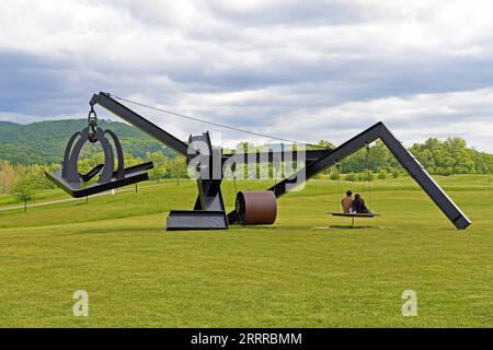230522 -- NEW YORK, May 22, 2023 -- Visitors sit on the wooden swinging bed of Mark di Suvero s artwork She at Storm King Art Center in New York, the United States, on May 21, 2023. Storm King Art Center is a 500-acre outdoor museum located in New York s Hudson Valley, where visitors experience large-scale sculpture and site-specific commissions under open sky.  U.S.-NEW YORK-STORM KING ART CENTER LixRui PUBLICATIONxNOTxINxCHN Stock Photo