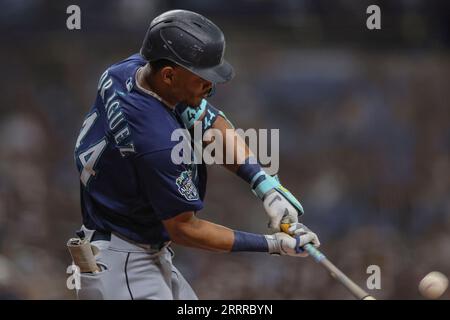 St. Petersburg, FL USA; Seattle Mariners center fielder Julio Rodriguez (44) hits a fly ball to Tampa Bay Rays right fielder Josh Lowe (15) during an Stock Photo