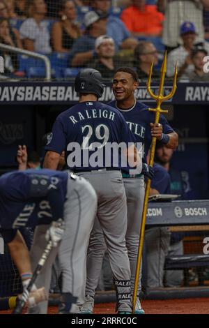 Seattle Mariners' Cal Raleigh (29) greets J.P. Crawford as they