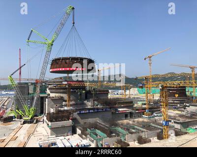 230522 -- LIANYUNGANG, May 22, 2023 -- This photo taken on May 19, 2023 shows a crawler crane lifting the circular belt of the reactor dome of the Tianwan nuclear power plant Unit 7 in east China s Jiangsu Province. TO GO WITH Across China: Tianwan nuclear power plant installs key component of Unit 7 China National Nuclear Corporation/Handout via Xinhua CHINA-JIANGSU-TIANWAN NUCLEAR POWER PLANT-COMPONENT CN WangxChenxi PUBLICATIONxNOTxINxCHN Stock Photo