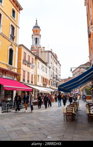 Venice, Italy - April 2, 2022: Crowd of visitors walking on the Nova Strada, a busy shopping street with shops and restaurants in Venice. Stock Photo