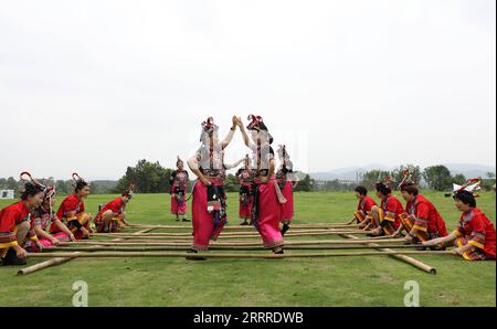 230525 -- LONGYOU, May 25, 2023 -- Local residents perform traditional bamboo dance in Pushan Village of Longyou County, east China s Zhejiang Province, May 24, 2023. Pushan Village has donned a new look with improved public infrastructure and colorful decoration in the past years. Entertainment facilities and homestay businesses have also been developed to boost tourism and increase local villagers income, injecting momentum and vitality into rural revitalization.  CHINA-ZHEJIANG-RURAL REVITALIZATION CN DuxXiaoyi PUBLICATIONxNOTxINxCHN Stock Photo