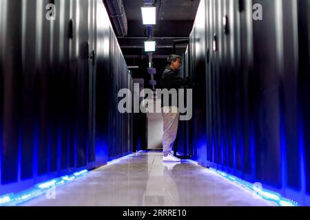 230525 -- GUIYANG, May 25, 2023 -- A staff member checks facilities at the State Key Laboratory of Public Big Data at Guizhou University in Guiyang, southwest China s Guizhou Province, May 23, 2023. As the first of its kind in the field of big data in the country, Guizhou University s State Key Laboratory of Public Big Data has three stable research directions, including multi-source data fusion and integration technology, public big data security and privacy protection, block data and regional governance.  CHINA-GUIZHOU-PUBLIC BIG DATA-STATE KEY LABORATORY CN LiuxXu PUBLICATIONxNOTxINxCHN Stock Photo