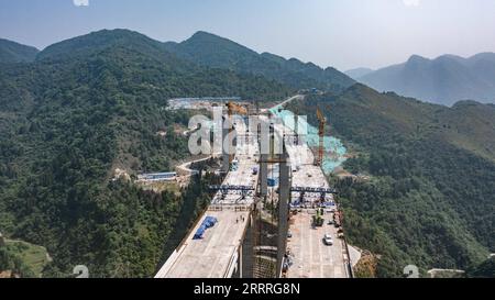 230527 -- JINSHA, May 27, 2023 -- This aerial photo taken on May 27, 2023 shows the construction site of Qingchi grand bridge in Jinsha County of Bijie City, southwest China s Guizhou Province. The bridge is a key project along the Guiyang-Jinsha-Gulin expressway. The construction of the bridge has been proceeding smoothly.  CHINA-GUIZHOU-JINSHA-BRIDGE-CONSTRUCTION CN TaoxLiang PUBLICATIONxNOTxINxCHN Stock Photo