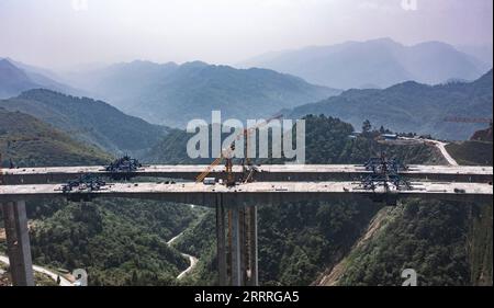 230527 -- JINSHA, May 27, 2023 -- This aerial photo taken on May 27, 2023 shows the construction site of Qingchi grand bridge in Jinsha County of Bijie City, southwest China s Guizhou Province. The bridge is a key project along the Guiyang-Jinsha-Gulin expressway. The construction of the bridge has been proceeding smoothly.  CHINA-GUIZHOU-JINSHA-BRIDGE-CONSTRUCTION CN TaoxLiang PUBLICATIONxNOTxINxCHN Stock Photo