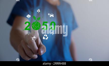 Hand holding virtual Global with CO2 reducing icon for concept of ...