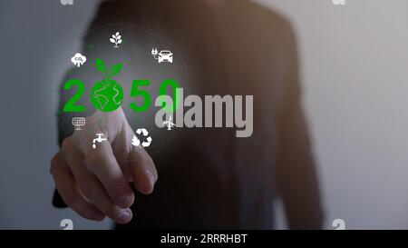 Hand holding virtual Global with CO2 reducing icon for concept of ...