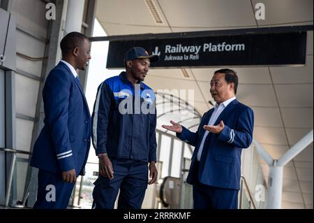 230601 -- NAIROBI, June 1, 2023 -- Chinese instructor Mao Xin R talks with colleagues at the Nairobi Station of the Mombasa-Nairobi Railway in Nairobi, Kenya, May 23, 2023. Mao works for the transportation department of Africa Star Railway Operation Company. He and his apprentice Peter Njenga have been working together on the dispatching plan to regulate train operation. We have brought Chinese technical standards to Kenya without reservation, and most apprentices have reached the same operating standards. Mao said that helping Kenya build the first modern railway is a highlight of his career. Stock Photo