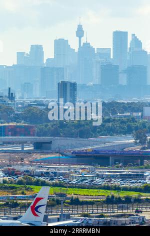 Construction of the Sydney Gateway project in Sydney, Australia, seen from Sydney Airport and Airport Drive with the Sydney city skyline in the backgr Stock Photo