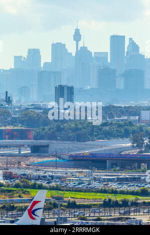 Construction of the Sydney Gateway project in Sydney, Australia, seen from Sydney Airport and Airport Drive with the Sydney city skyline in the backgr Stock Photo