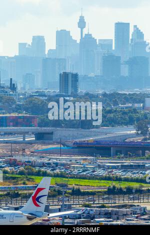 Construction of the Sydney Gateway project in Sydney, Australia, seen from Sydney Airport and Airport Drive with the Sydney city skyline in the backgr Stock Photo