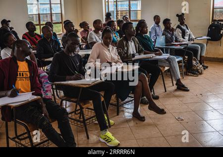 230611 -- ITEN, June 11, 2023 -- Kenyan runner Kelvin Kimtai Chepsigor front, 2nd L from Kisii University takes notes at Kisii University in Kisii, Kenya, on June 6, 2023. At nearly 6 am, the first morning light shines upon the landmark arch written with Home of Champions in Iten, the runners gathered here to greet each other with a fist bump, stretch their muscles, and prepare for the first training session of the day. With an average altitude of 2,400 meters, Iten sits in the west of Kenya, near the Great Rift Valley of East Africa. It is an ideal long-distance running training place and is Stock Photo