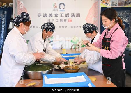 230612 -- HANGZHOU, June 12, 2023 -- Villagers make Qingtuan, a sweet green rice ball, in Miaohouzhou Village of Ningbo, east China s Zhejiang Province, March 8, 2023. In June 2003, Zhejiang launched the Green Rural Revival Program, which plans to renovate about 10,000 incorporated villages and transform about 1,000 central villages among them into examples of moderate prosperity in all respects. Thanks to the program, the image of the countryside has been comprehensively lifted in Zhejiang Province. A total of 2,170 featured villages and over 3 million beautiful rural courtyards have been bui Stock Photo