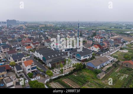 230613 -- CIXI, June 13, 2023 -- This aerial photo taken on June 13, 2023 shows a view of Wan anzhuang Village in Cixi City, east China s Zhejiang Province. Cixi City has been promoting rural revitalization for years. The living environment and life quality of locals have been significantly improved, and the ecological environment of rural areas has also been optimized. In June 2003, Zhejiang launched the Green Rural Revival Program, which plans to renovate about 10,000 incorporated villages and transform about 1,000 central villages among them into examples of moderate prosperity in all respe Stock Photo