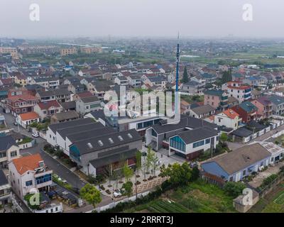 230613 -- CIXI, June 13, 2023 -- This aerial photo taken on June 13, 2023 shows a view of Wan anzhuang Village in Cixi City, east China s Zhejiang Province. Cixi City has been promoting rural revitalization for years. The living environment and life quality of locals have been significantly improved, and the ecological environment of rural areas has also been optimized. In June 2003, Zhejiang launched the Green Rural Revival Program, which plans to renovate about 10,000 incorporated villages and transform about 1,000 central villages among them into examples of moderate prosperity in all respe Stock Photo