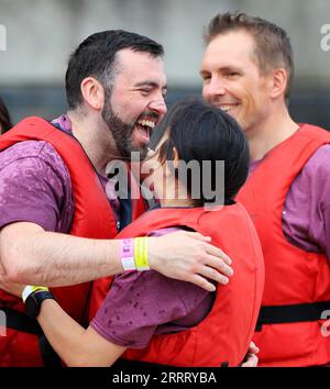 230618 -- SALFORD, June 18, 2023 -- Contestants celebrate during the 2023 UK Chinese Dragon Boat Festival in Salford, Britain, June 17, 2023. The festival also featured traditional Chinese lion dance, singing, martial art and calligraphy, making it great fun for spectators and participants.  SPBRITAIN-SALFOLD-DRAGON BOAT FESTIVAL LixYing PUBLICATIONxNOTxINxCHN Stock Photo