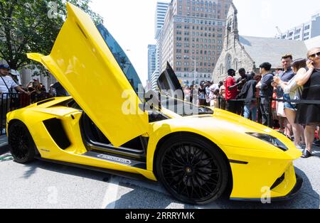 230619 -- TORONTO, June 19, 2023 -- People visit the 2023 Yorkville Exotic Car Show in Toronto, Canada, on June 18, 2023. The annual event was held here on Sunday to celebrate Father s Day with about 100 cars on display. Photo by /Xinhua CANADA-TORONTO-EXOTIC CAR SHOW ZouxZheng PUBLICATIONxNOTxINxCHN Stock Photo