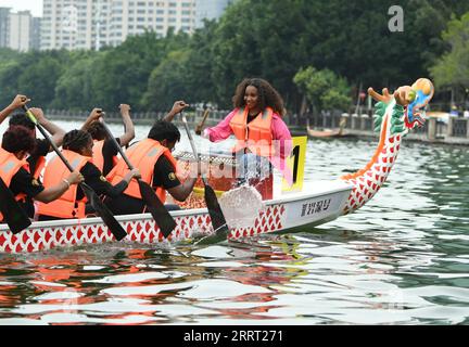 230624 -- FUZHOU, June 24, 2023 -- Students from Huaqiao University practice for a dragon boat race in Fuzhou of southeast China s Fujian Province, on June 20, 2023. The Dragon Boat Festival, also known as Duanwu Festival, traditionally falls on the fifth day of the fifth month in the Chinese lunar calendar. The dragon boat competition, a traditional part of the festival, has gained popularity on both sides of the Taiwan Strait, bringing excitement to a wide range of people. Located on the southeastern coast of China, Fujian Province is ideal for water sports with its widely scattered rivers, Stock Photo