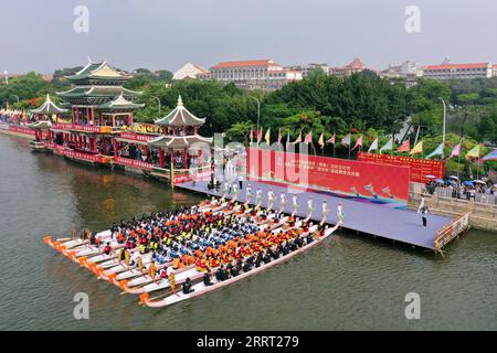 230624 -- FUZHOU, June 24, 2023 -- This aerial photo taken on June 3, 2023 shows rowers from both sides of the Taiwan Strait attending the opening ceremony of a dragon boat cultural festival in Xiamen, southeast China s Fujian Province. The Dragon Boat Festival, also known as Duanwu Festival, traditionally falls on the fifth day of the fifth month in the Chinese lunar calendar. The dragon boat competition, a traditional part of the festival, has gained popularity on both sides of the Taiwan Strait, bringing excitement to a wide range of people. Located on the southeastern coast of China, Fujia Stock Photo