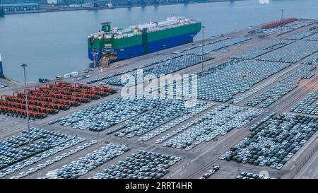 230629 -- SHENYANG/SHANGHAI, June 29, 2023 -- This aerial photo taken on Jan. 18, 2023 shows vehicles waiting for shipment at Yantai Port in Yantai, east China s Shandong Province.  Xinhua Headlines: China on track to become world s leading automobile exporter ZhuxZheng PUBLICATIONxNOTxINxCHN Stock Photo
