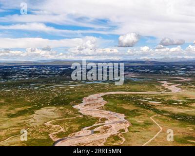 230630 -- GOLMUD, June 30, 2023 -- This aerial photo taken on July 23, 2021 shows a view of the Damqu River at the source region of the Yangtze River, China s longest river, in northwest China s Qinghai Province. The 6,300-kilometer Yangtze River, the longest river in China and the third longest in the world, has three sources, namely the Tuotuo River, the Damqu River in the south and the Qumar River in the north. Located in the hinterland of the Qinghai-Tibet Plateau between the Kunlun Mountains and the Tanggula Mountains, the Yangtze River source region, with an average elevation of more tha Stock Photo