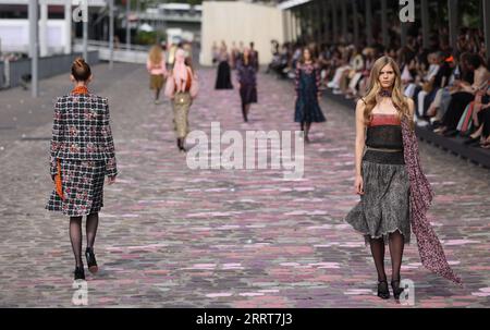 230704 -- PARIS , July 4, 2023 -- Models present creations of French fashion house Chanel s Autumn/Winter 2023/2024 Haute Couture collections during Paris Fashion Week in Paris, France, July 4, 2023.  FRANCE-PARIS-FASHION WEEK-CHANEL GaoxJing PUBLICATIONxNOTxINxCHN Stock Photo