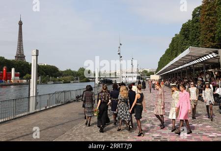 230704 -- PARIS , July 4, 2023 -- Models present creations of French fashion house Chanel s Autumn/Winter 2023/2024 Haute Couture collections during Paris Fashion Week in Paris, France, July 4, 2023.  FRANCE-PARIS-FASHION WEEK-CHANEL GaoxJing PUBLICATIONxNOTxINxCHN Stock Photo