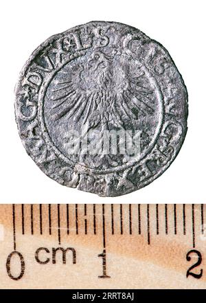 Antique silver Polish coin. King Sigismund II August. Reverse. Isolated on white Stock Photo