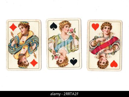 Vintage playing cards showing three queens on a white background. Stock Photo