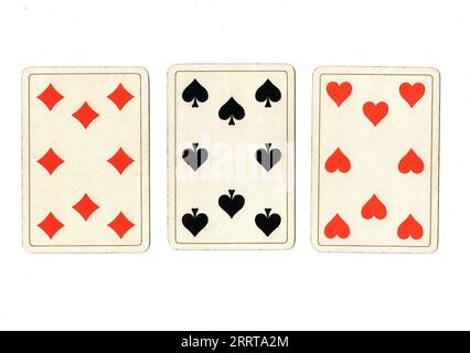 Vintage playing cards showing three eights on a white background. Stock Photo