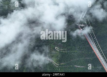 230709 -- JISHOU, July 9, 2023 -- This aerial photo taken on July 8, 2023 shows the Aizhai suspension bridge in Xiangxi Tujia and Miao Autonomous Prefecture, central China s Hunan Province.  CHINA-HUNAN-HIGHWAY-BRIDGE-AERIAL VIEW CN ZhaoxZhongzhi PUBLICATIONxNOTxINxCHN Stock Photo