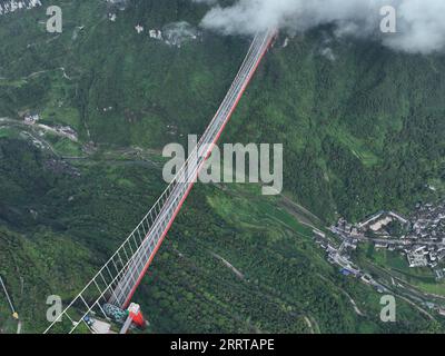 230709 -- JISHOU, July 9, 2023 -- This aerial photo taken on July 8, 2023 shows the Aizhai suspension bridge in Xiangxi Tujia and Miao Autonomous Prefecture, central China s Hunan Province.  CHINA-HUNAN-HIGHWAY-BRIDGE-AERIAL VIEW CN ZhaoxZhongzhi PUBLICATIONxNOTxINxCHN Stock Photo