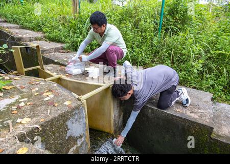 230717 -- ZHONGXIAN, July 17, 2023 -- Researchers of the Institute of Mountain Hazards and Environment under Chinese Academy of Sciences CAS collect water samples in Zhongxian County, southwest China s Chongqing, July 6, 2023. The Three Gorges Reservoir region, home to the world s largest hydropower project, covers about 10,000 square km along the Yangtze River, China s longest waterway. The seasonal gaps in the reservoir s water levels have resulted in a water-level fluctuation zone covering 349 square kilometers along the Yangtze River. The zone suffers environmental problems, including soil Stock Photo