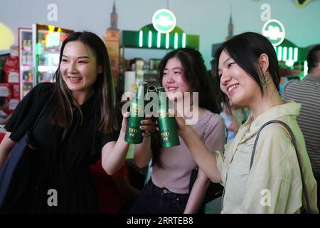 230720 -- HARBIN, July 20, 2023 -- Visitors taste beer at the 21th China Harbin International Beer Festival in Harbin, capital of northeast China s Heilongjiang Province, July 20, 2023. The 21th China Harbin International Beer Festival opened here on Thursday.  CHINA-HEILONGJIANG-HARBIN-BEER FESTIVAL-OPEN CN ZhangxTao PUBLICATIONxNOTxINxCHN Stock Photo