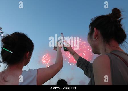 230720 -- HARBIN, July 20, 2023 -- Visitors watch a fireworks show at the 21th China Harbin International Beer Festival in Harbin, capital of northeast China s Heilongjiang Province, July 20, 2023. The 21th China Harbin International Beer Festival opened here on Thursday.  CHINA-HEILONGJIANG-HARBIN-BEER FESTIVAL-OPEN CN ZhangxTao PUBLICATIONxNOTxINxCHN Stock Photo