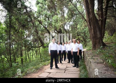 230726 -- CHENGDU, July 26, 2023 -- General Secretary of the Communist Party of China Central Committee Xi Jinping, also Chinese president and chairman of the Central Military Commission, visits the site of a section of an ancient road system known as Shudao in Guangyuan City, southwest China s Sichuan Province, July 25, 2023. Xi inspected southwest China s Sichuan Province on Tuesday and Wednesday. He visited the site of a section of an ancient road system known as Shudao in Guangyuan City and the Sanxingdui Museum in Deyang City, respectively. Xi learned about efforts in historical and cultu Stock Photo