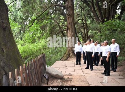 230726 -- CHENGDU, July 26, 2023 -- General Secretary of the Communist Party of China Central Committee Xi Jinping, also Chinese president and chairman of the Central Military Commission, visits the site of a section of an ancient road system known as Shudao in Guangyuan City, southwest China s Sichuan Province, July 25, 2023. Xi inspected southwest China s Sichuan Province on Tuesday and Wednesday. He visited the site of a section of an ancient road system known as Shudao in Guangyuan City and the Sanxingdui Museum in Deyang City, respectively. Xi learned about efforts in historical and cultu Stock Photo