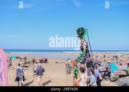 Watergate Bay, Cornwall, UK. 9th September 2023. UK Weather.  The giant Eko puppet on a hot and sunny beach at Watergate bay this morning,  as part of the arts on the beach event at Watergate bay today. Credit SImon Maycock / Alamy Live News. Stock Photo