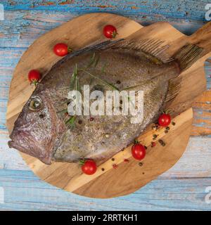 Saint-Pierre Seafish, Zeus Faber, John Dory, Pez de San Pedro, fish, isolated on cutting board background Stock Photo